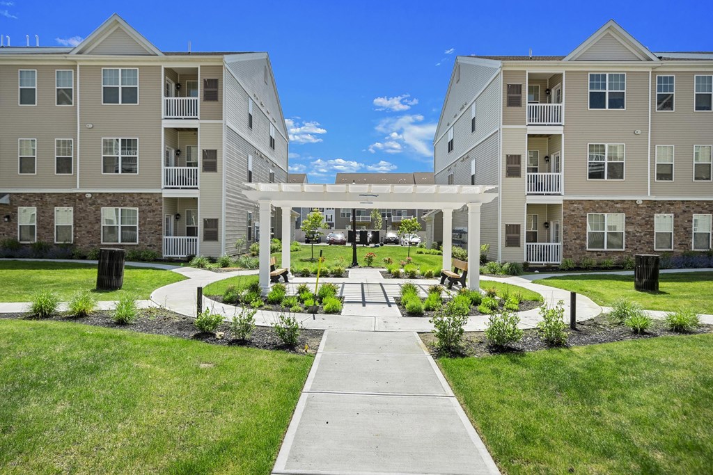 A large building with a walkway in front of it.
