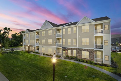 A building with a balcony and a lamp post in front of it at Heritage at Mount Holly, Mount Holly, NJ.
