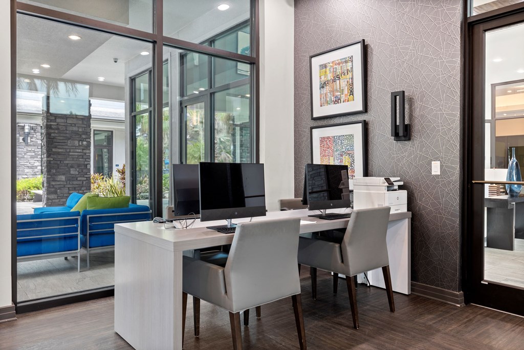 a home office with two computers and a printer on a desk at Pearce at Pavilion Luxury Apartments, Riverview, FL, Florida, 33578