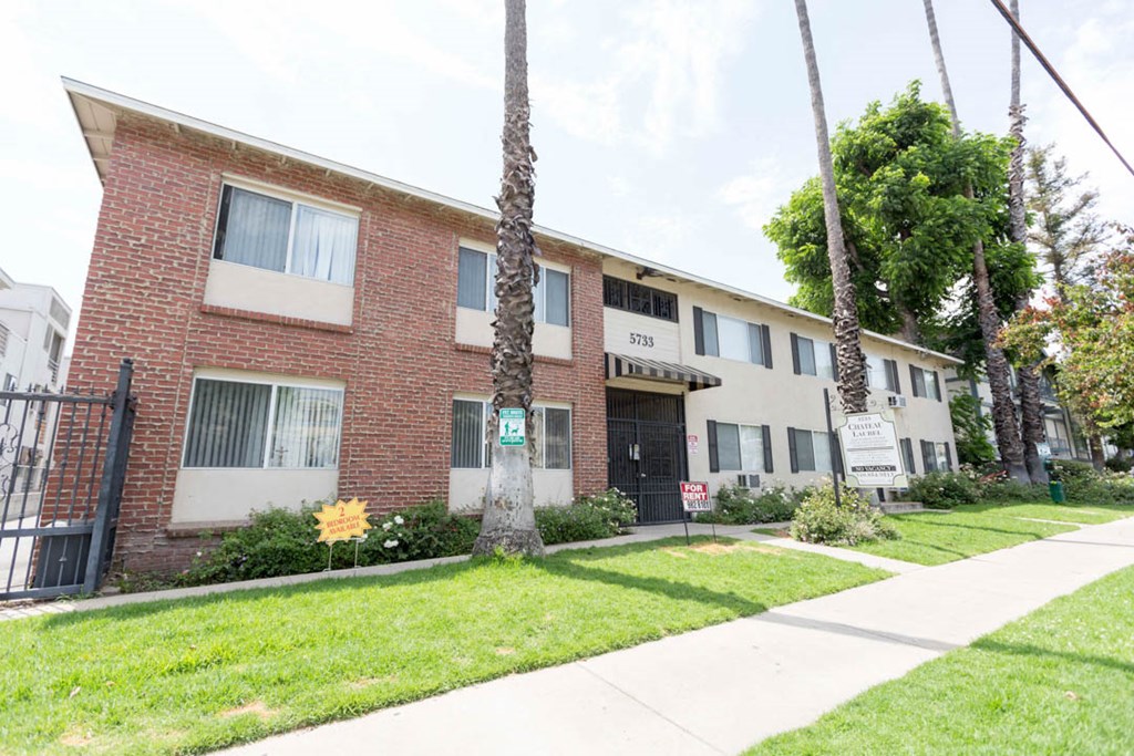 Front of building with sidewalk and grass