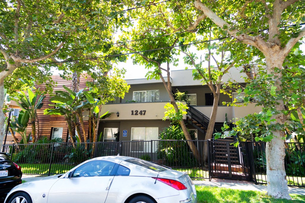 Entrance with car and trees