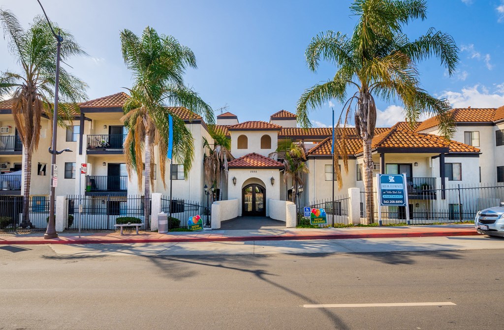a building with palm trees in front of it