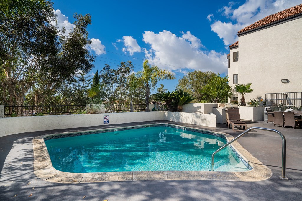 Swimming pool with view of sky and clouds