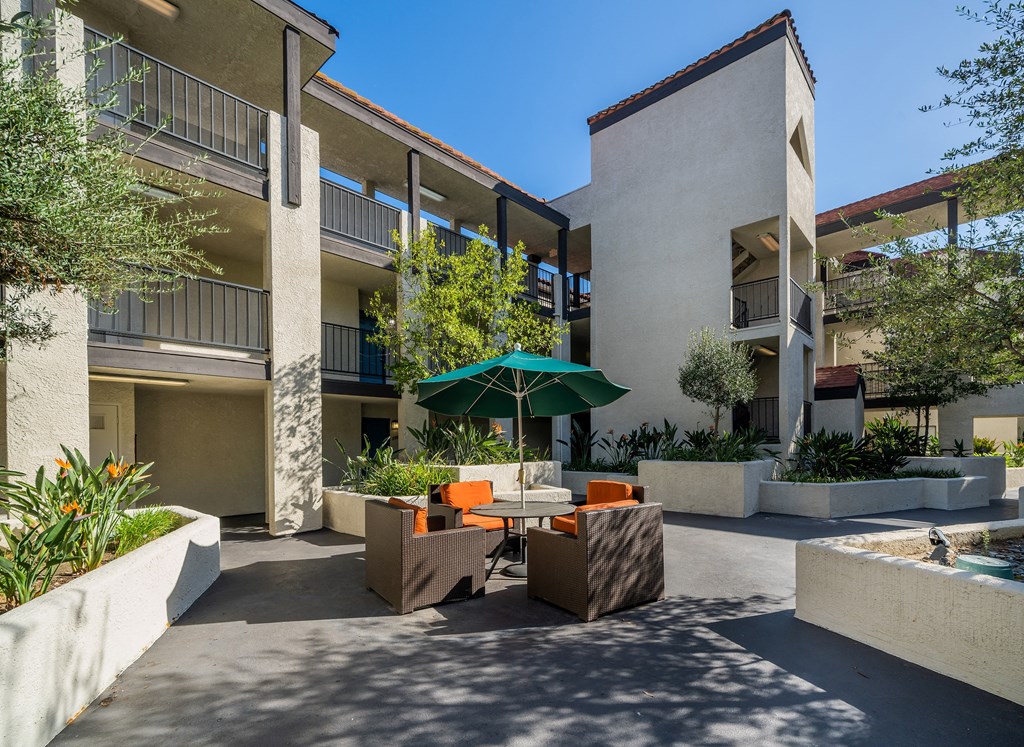 Courtyard with seating area and view of building