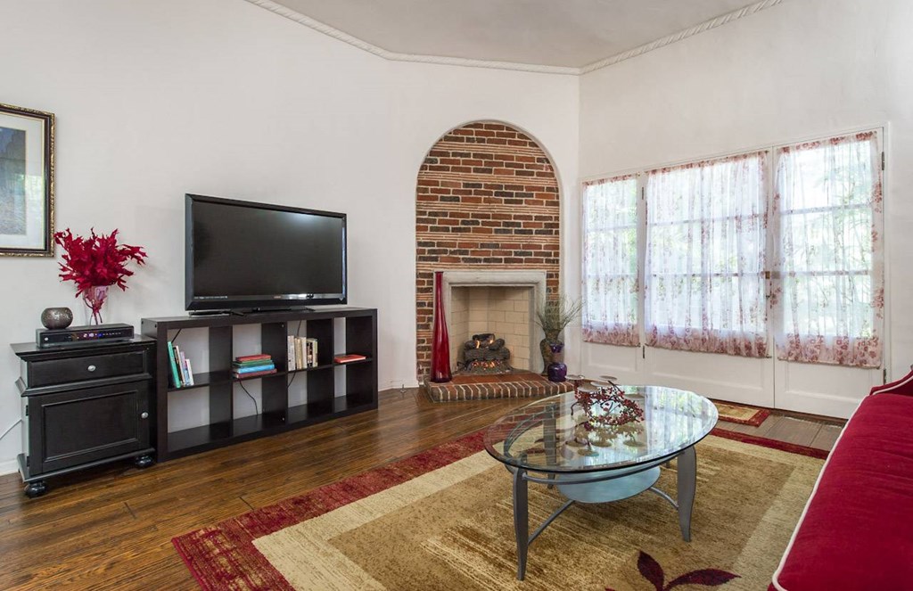 Villa Valentino 14 Living Room with view of black TV Counsel and brick fireplace
