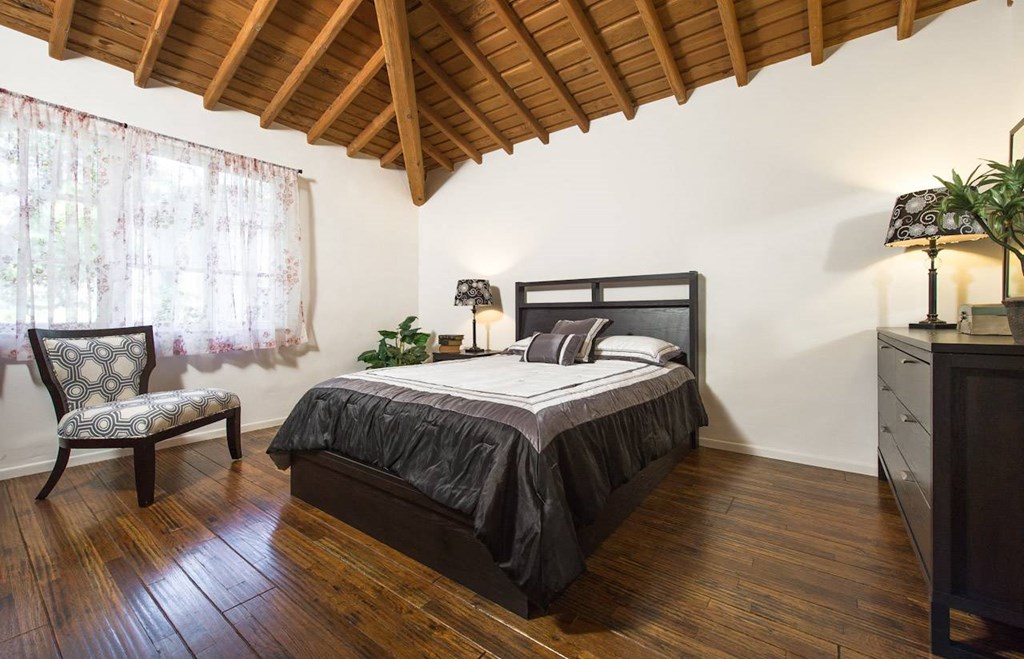 Villa Valentino 14 Master Bedroom and large window and wooden ceiling
