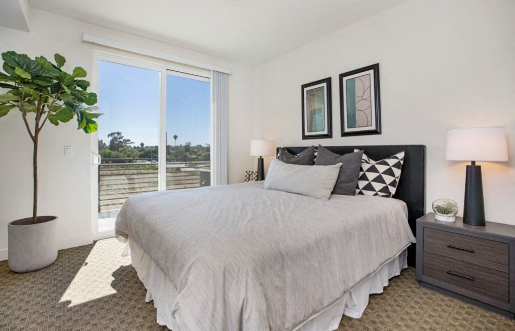 bedroom with screen doors with view of fields