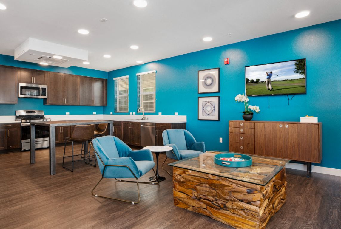 Community room with kitchen and TV