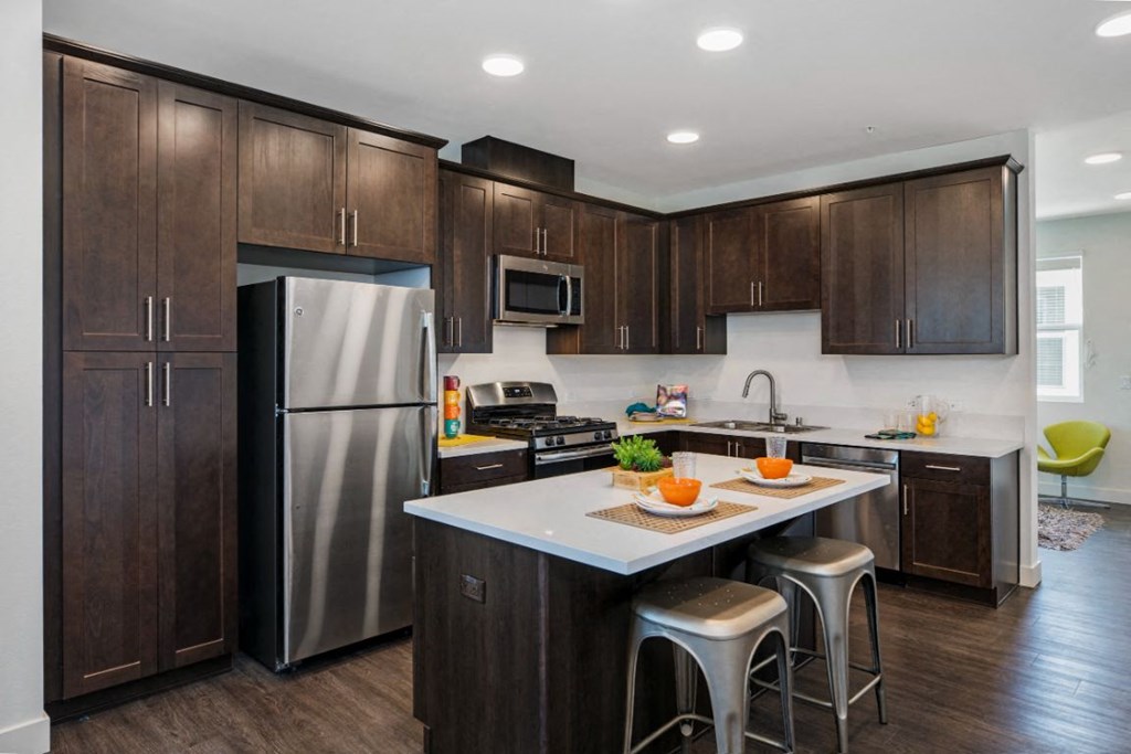 Kitchen with stainless steel fridge