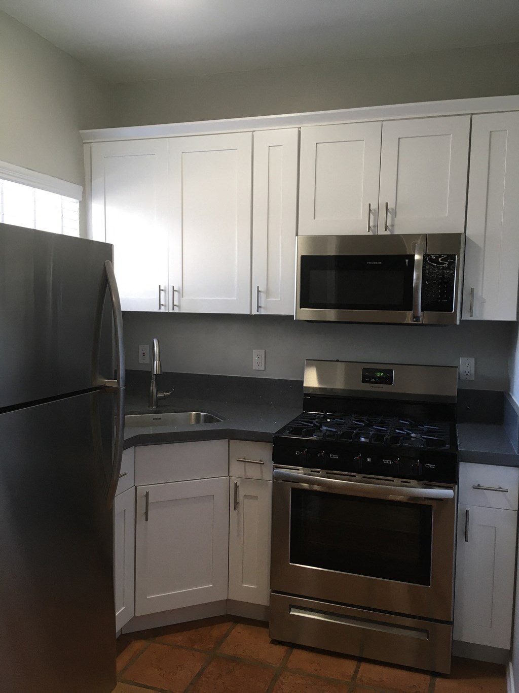 Kitchen with gray countertops