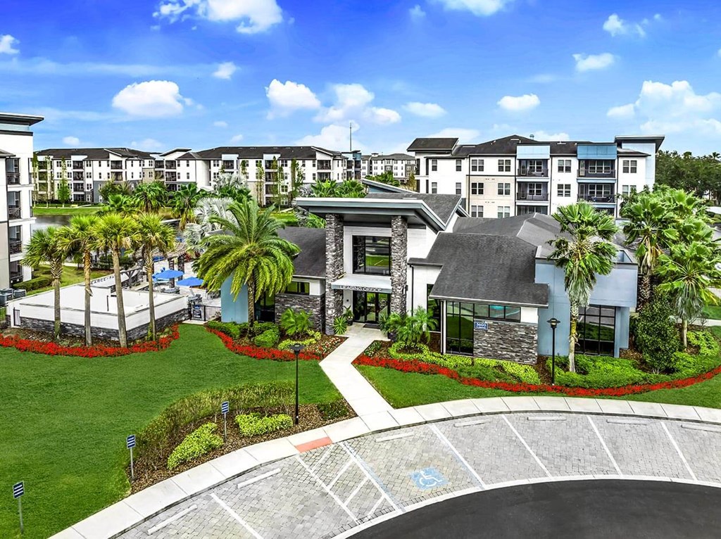 an aerial view of the property with palm trees and other buildings at Pearce at Pavilion Luxury Apartments, Riverview, FL, 33578
