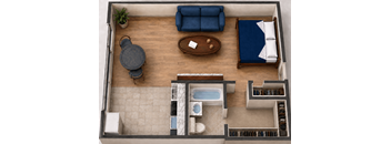 A top view of a living room with a sofa, a table, and a potted plant.