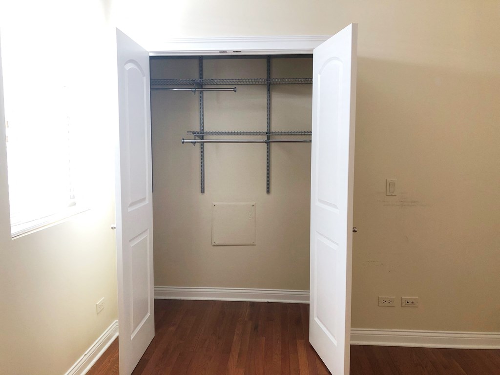 a walk in closet in a 555 waverly unit