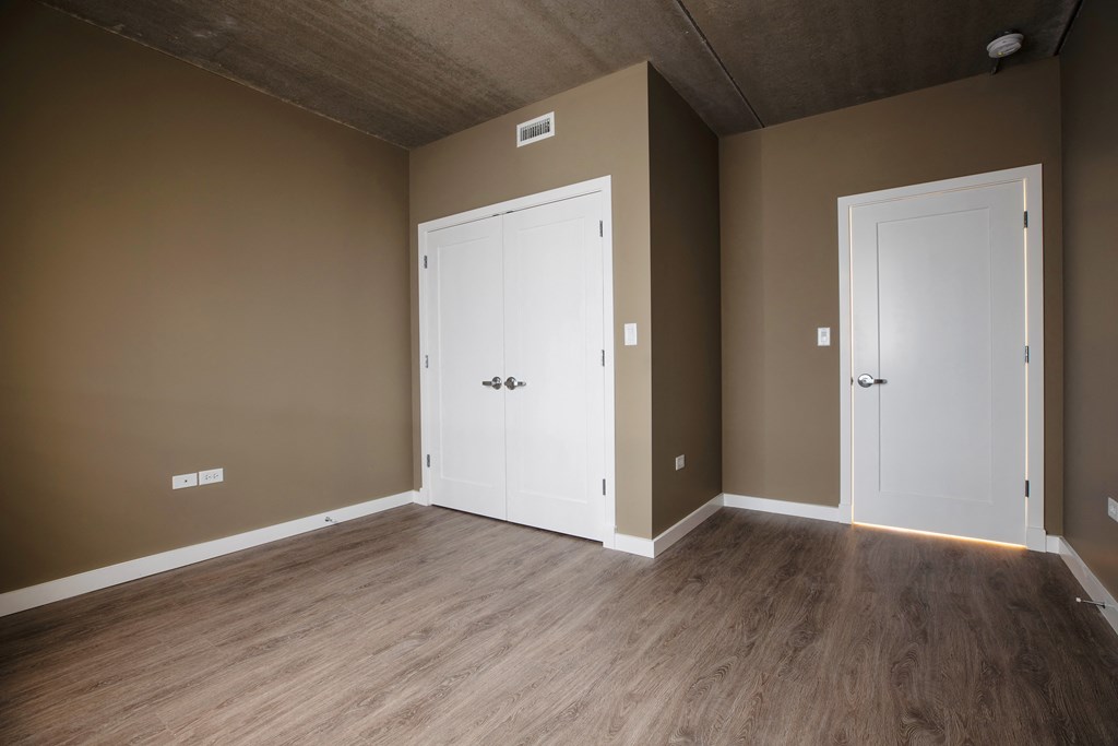 an empty room with two doors