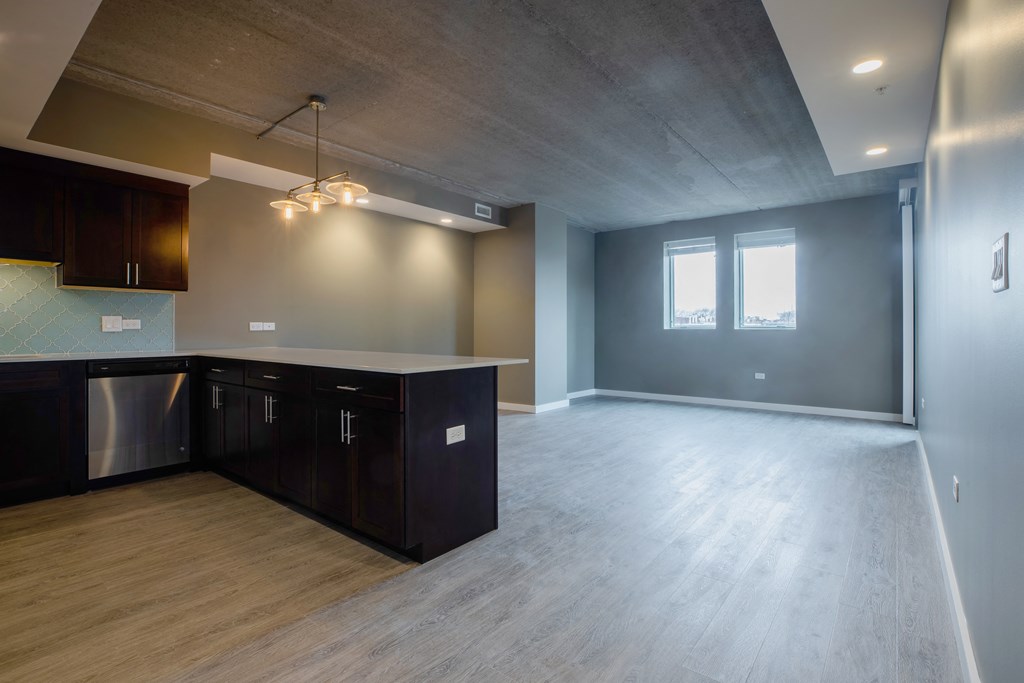 kitchen and living room in a bedroom plus den unit.