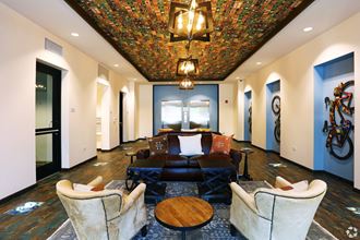 a large room with a large couch and chairs - Photo Gallery