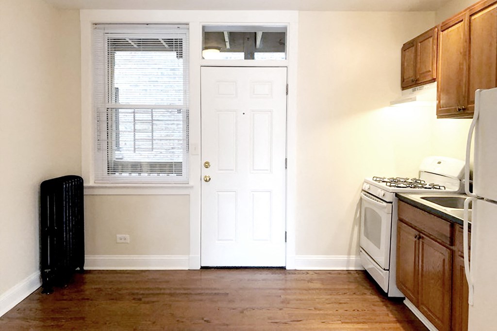 a kitchen with a stove and a refrigerator