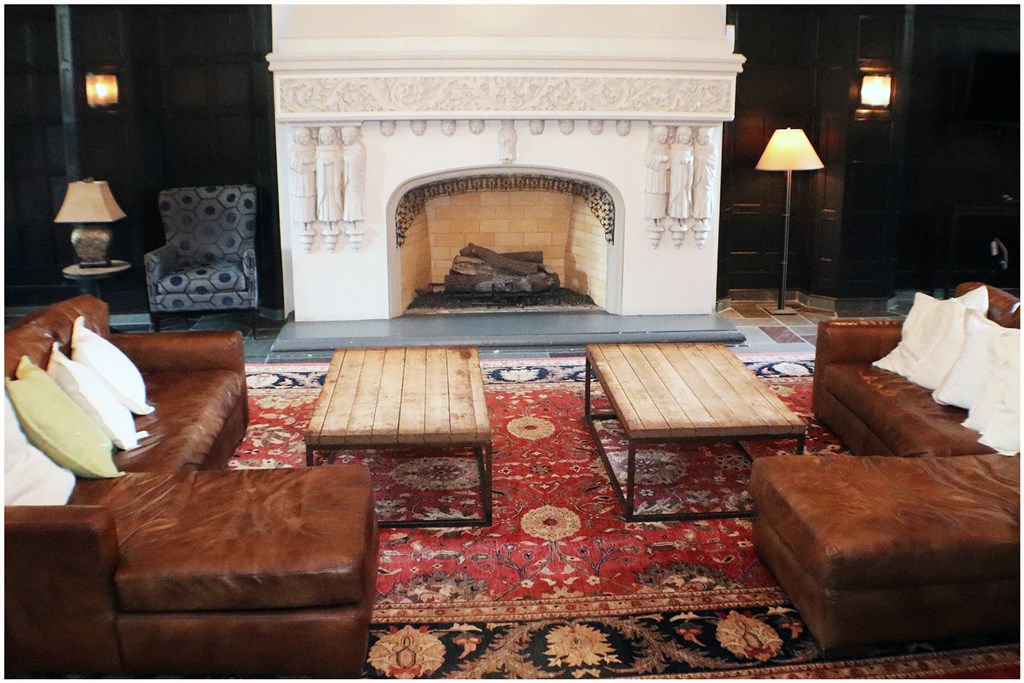 a living room with a fireplace and couches