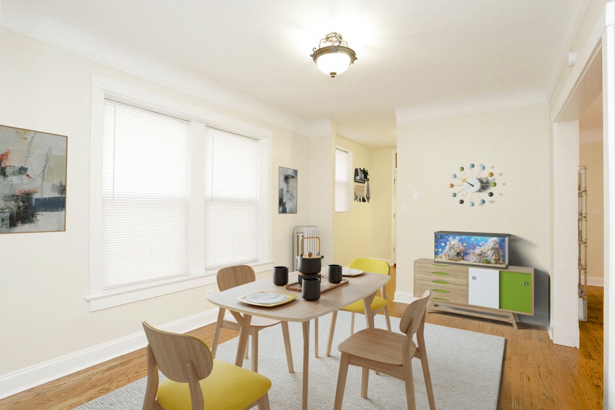 a dining room with a table and chairs