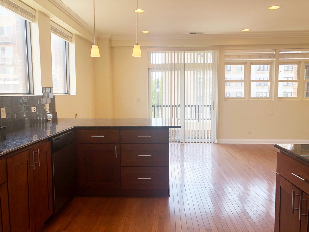 a view of the kitchen and living room from the dining room