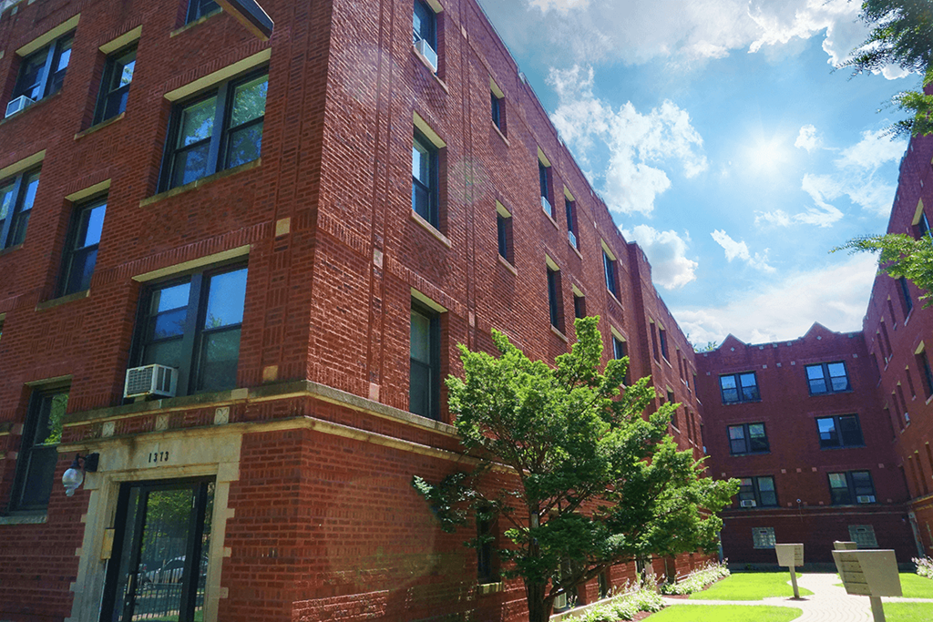 a red brick building on a sunny day