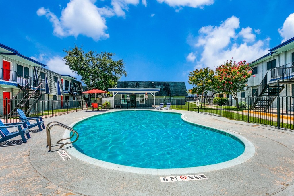 the swimming pool at the residence on lamar apartment homes for rent