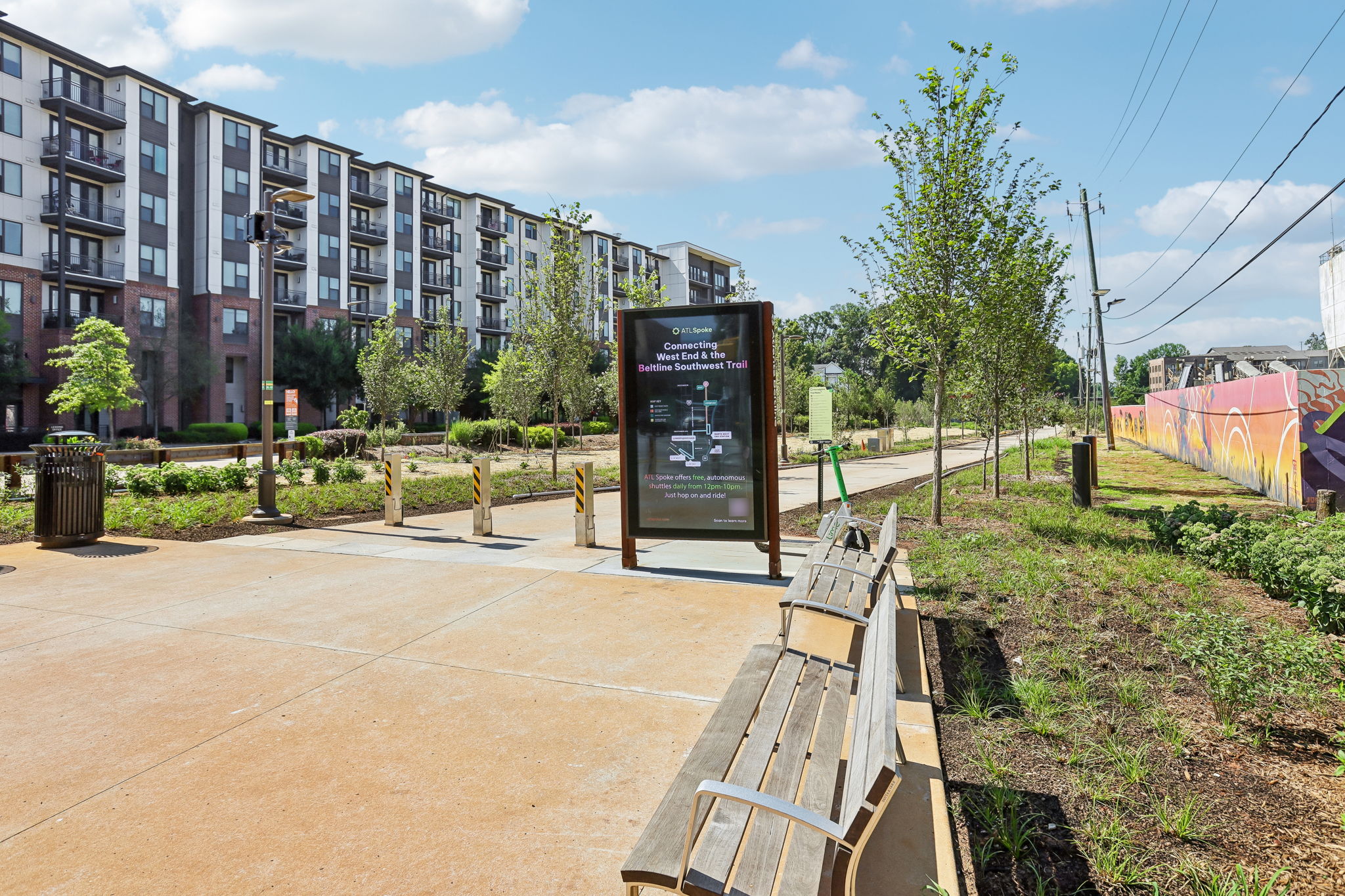 A signboard in front of apartment buildings.