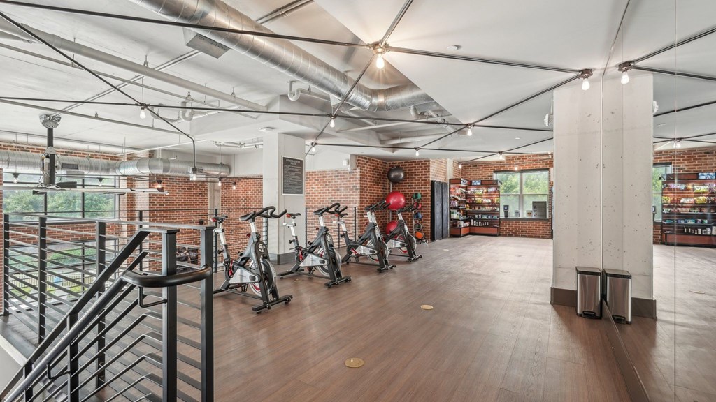 A gym with exercise bikes and convenient store.