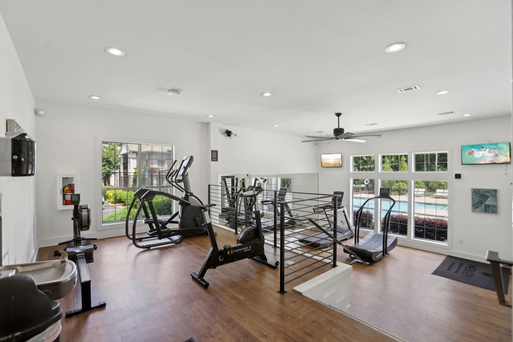 A spacious gym with a variety of exercise equipment.