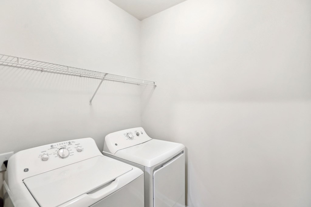 A laundry room with washer and dryer.