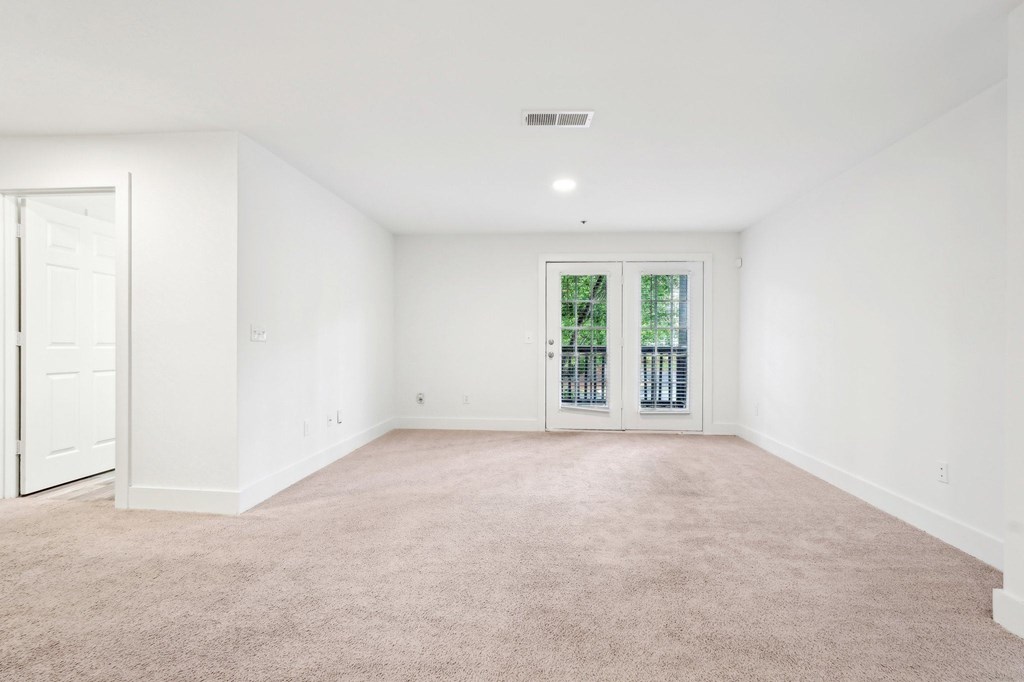 Living room with carpet and window