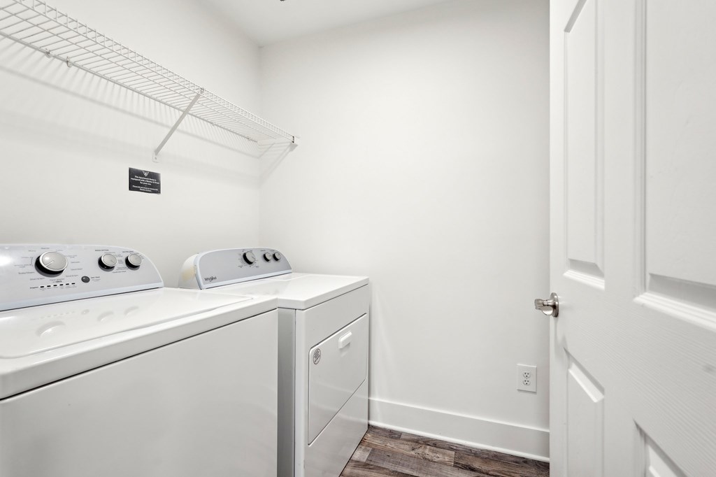 A laundry room with a washer and dryer.