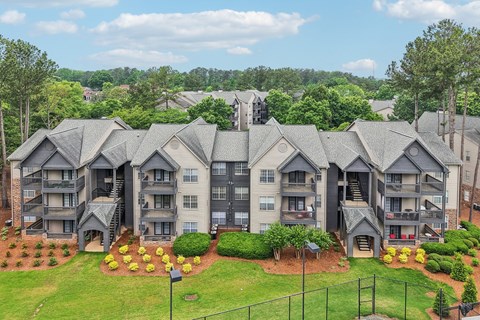 A large apartment complex with multiple buildings and landscaped gardens.