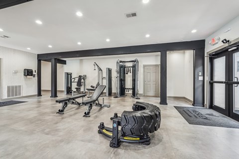 A gym with a variety of equipment