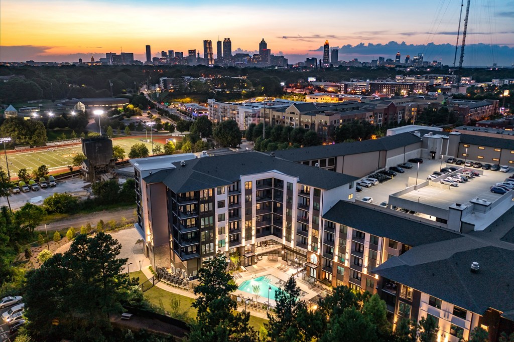 Luxury Atlanta apartment community with resort-style pool, rooftop parking, and skyline views