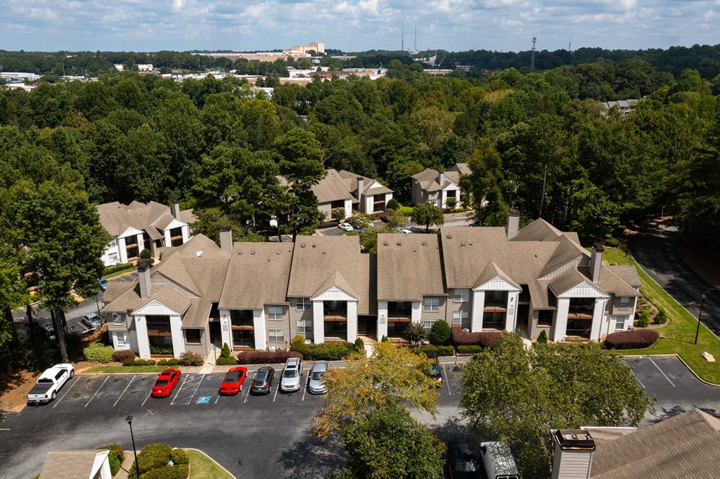aerial view of apartment homes  with parking in front of it