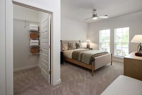 bedroom with guaranteed ceiling fan, walk-in closet, natural lighting, and tons of space for activities