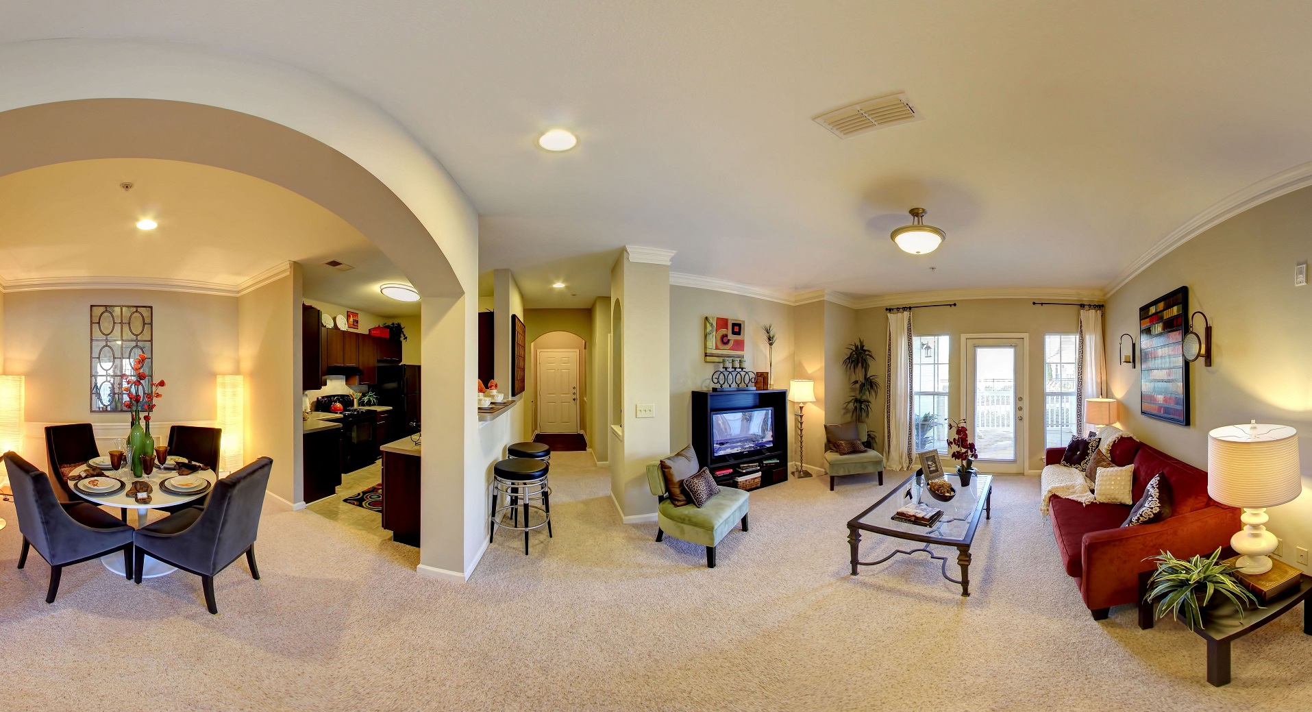 a living room filled with furniture and a tv