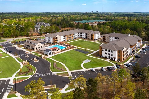 aerial view of station 75 apartments with the pool and buildings in view
