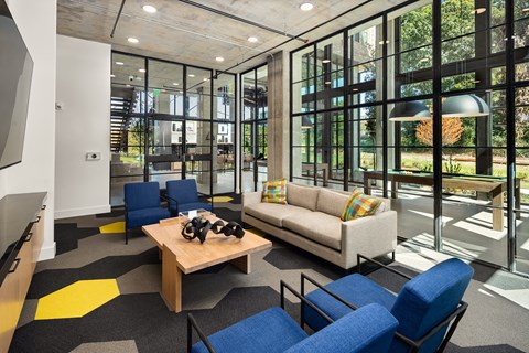a living room with couches and chairs and a table