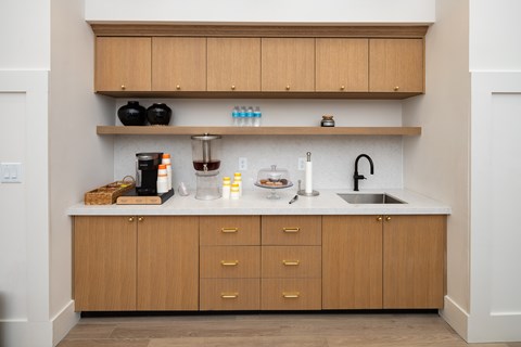 A kitchen with wooden cabinets and a white countertop.
