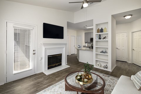 a living room with a fireplace and a table