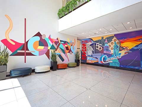Colorful lobby mural with seating area at Residences at 55 Apartments, Cleveland, 44113
