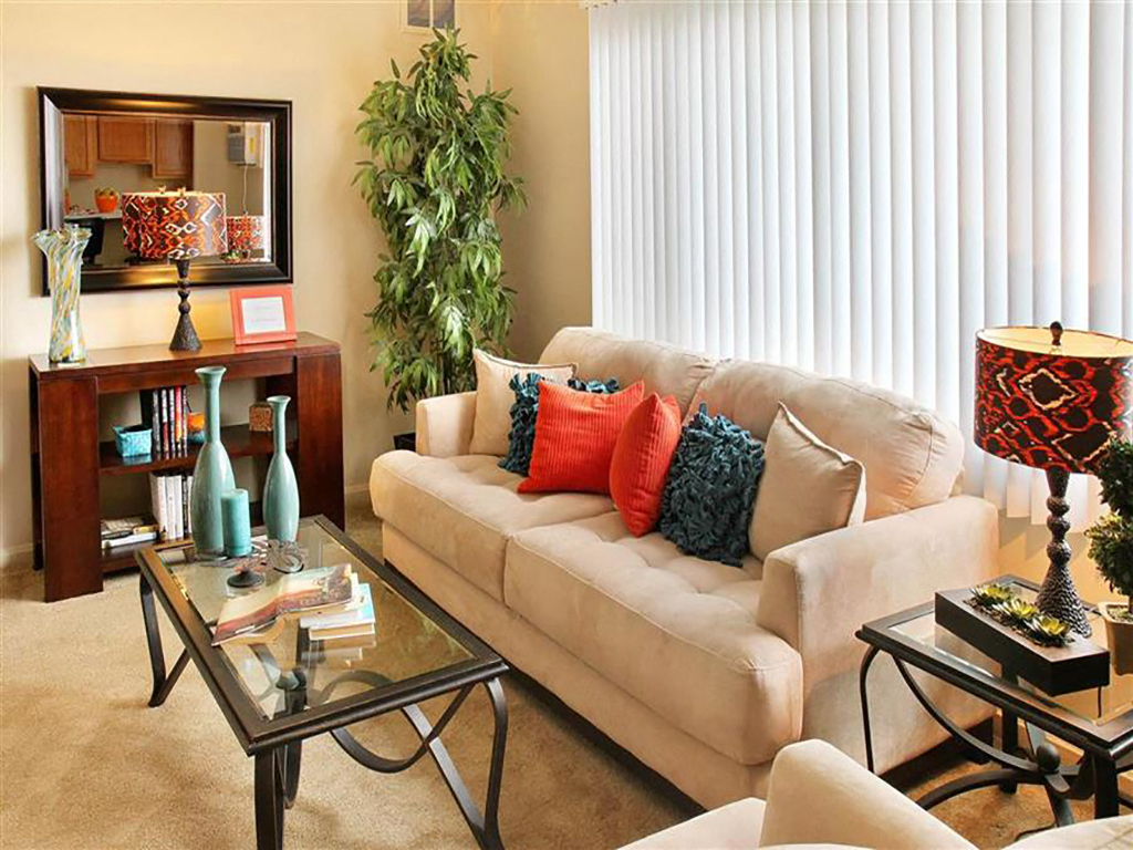 a living room with a couch and a table