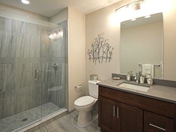 Ceramic Tile Floors & Quartz Countertops in Bathrooms at The Terminal Tower Residences, Cleveland