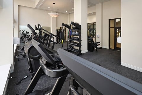 Fitness center with cardio machines and strength equipment at The Electric Building Apartments, Cleveland, OH 44115