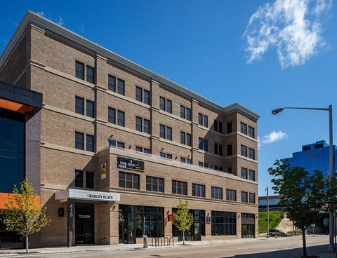 A building with the name "FARLEY FLATS" on the front.
