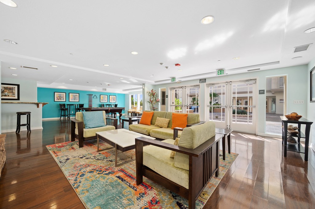 a living room filled with furniture and a large rug