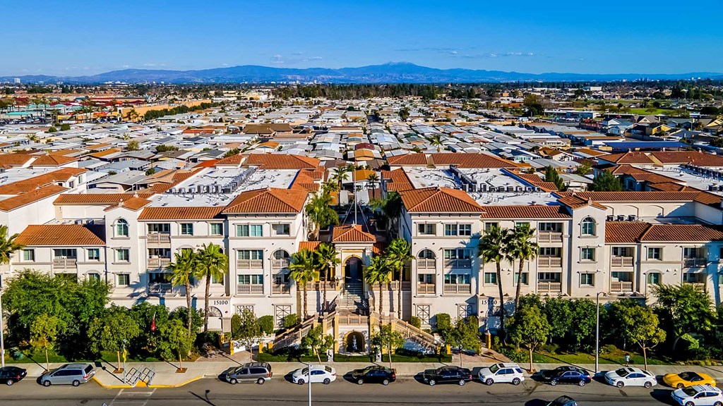 a aerial view of a city with buildings and cars