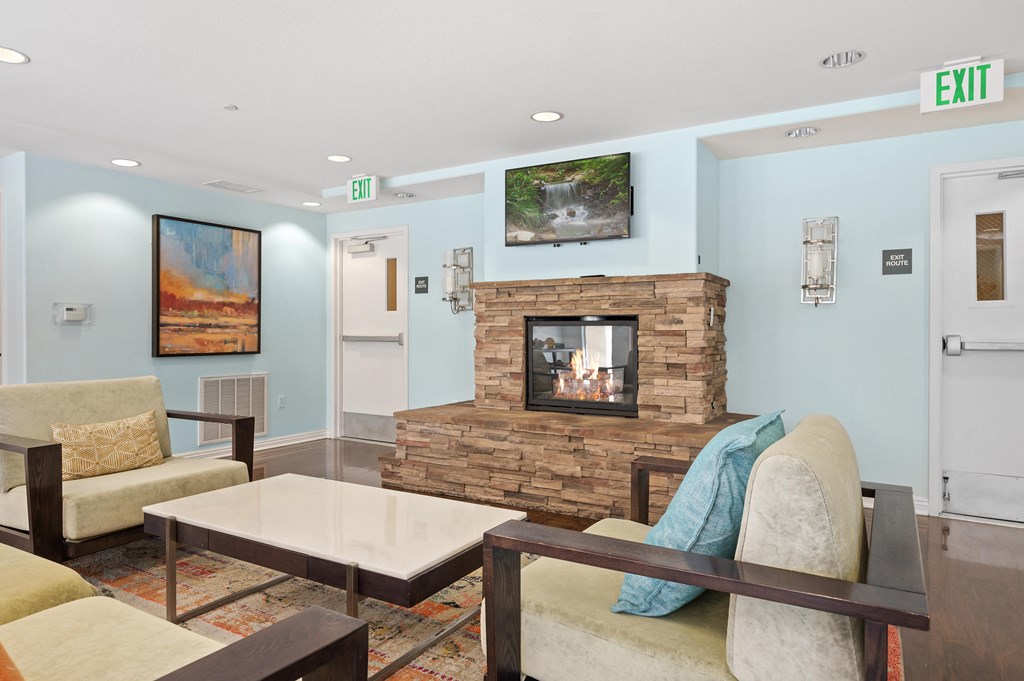 a living room with a fireplace and couches